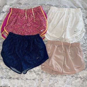 Bundle of 4 Nike DRI-FIT Women's Shorts Set in Pink, White, Blue, and Tan